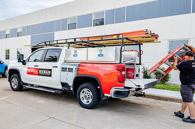Garage door installer prepping his truck for work