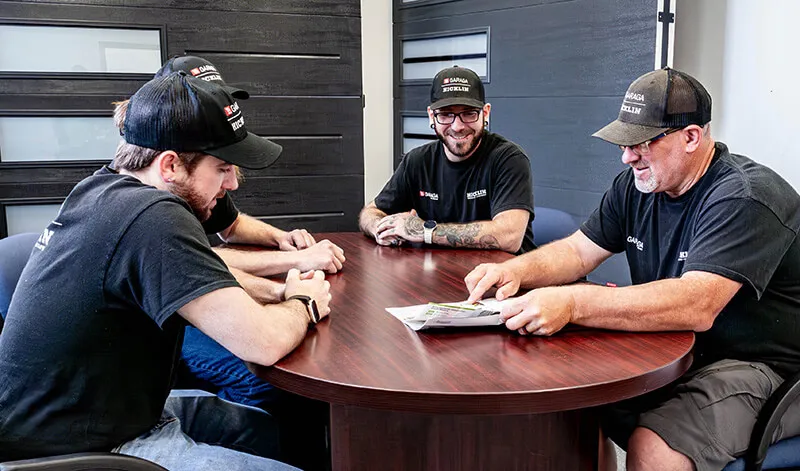 Garage door specialists working on a plan