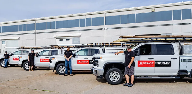Garage door installers in front of all their truck from Hicklin Garage Door Cedar Rapids